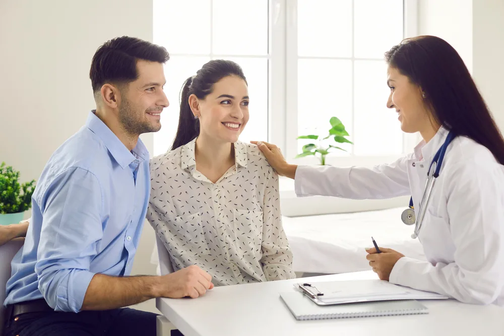 A couple asking questions during a fertility consultation