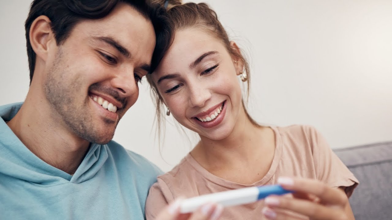 A couple sharing the result of a pregnancy test