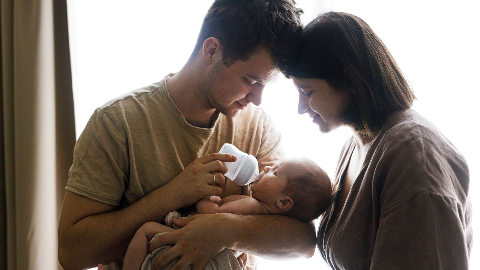 Parents sharing a quiet moment with their newborn
