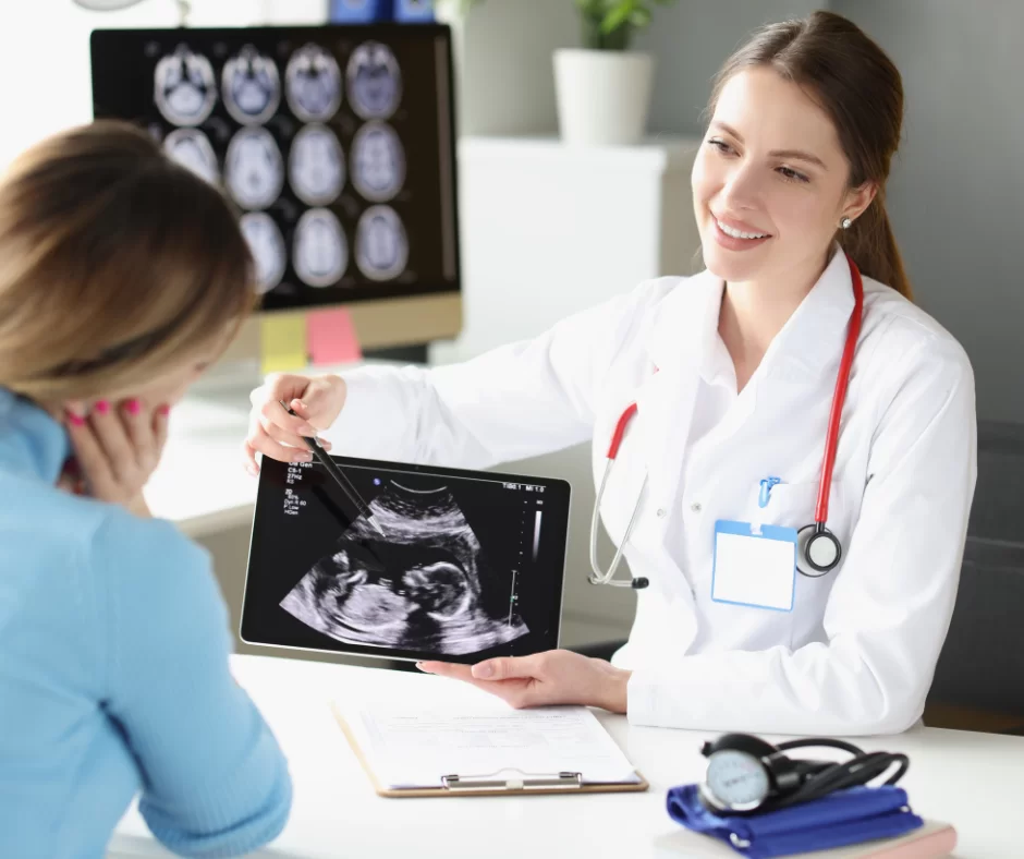 A physician reviewing ultrasound results with a patient